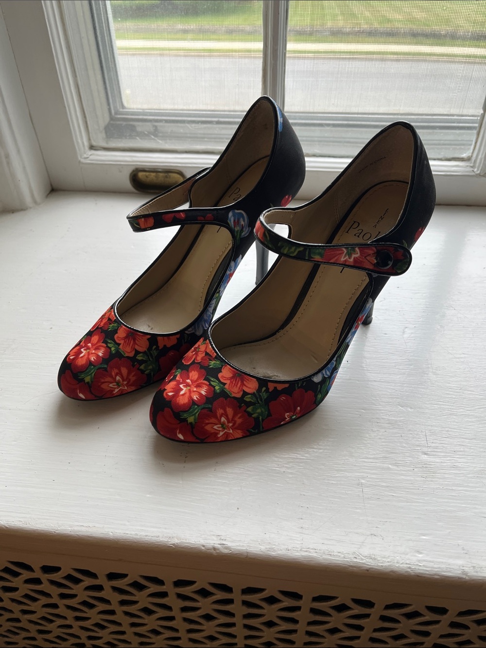 Paolo flower Mary Jane pumps.